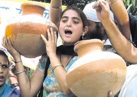 Activists of the National Akali Dal protesting against the shortage of water in the Capital. 