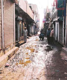 A view of Oswal Street that has not been recarpeted after a sewer was laid about two years ago