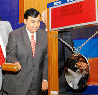 Reliance Petroleum Chairman Mukesh D. Ambani performs a traditional ceremony at the companys listing on the BSE in Mumbai on Thursday. 