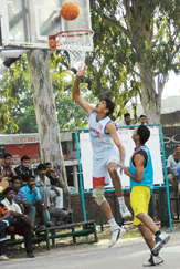 An NSW cager tries to put the ball in the basket in the semifinal match of  the CRPF Inter-Sector meet at Sports Complex, Sector 7, Chandigarh, on Thursday.  