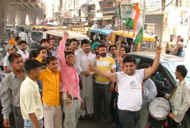 Activists of the District Youth Congress celebrate the victory of Ms Sonia Gandhi in the Rae Bareli parliamentary byelection