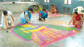 Nursing students make rangoli during the Nurses Week celebrations in Ludhiana