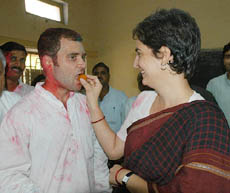 Priyanka Gandhi offers sweets to Amethi MP and her brother Rahul Gandhi in New Delhi on Thursday after their mother and Congress President Sonia Gandhi retained the Rae Bareli parliamentary seat with a record win in the byelection held on May 8. 
