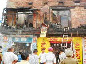 The damaged portion of the building that caught fire in Tarn Taran