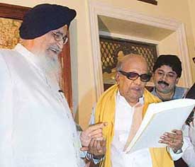 Tamil Nadu Governor S.S. Barnala hands over a letter to DMK supremo M. Karunanidhi offering him to form the new government, in Chennai on Friday. 