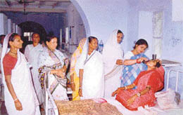 Trained nursing aides administer medicine