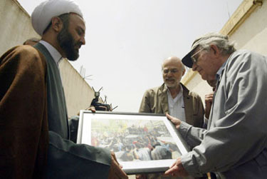 Prominent US Leftist Noam Chomsky, an emeritus professor of linguistics at the Massachusetts Institute of Technology and a loud critic of US foreign policy, receives a gift from Hezbollah leader Sheikh Nabil Qaouq during a visit to the former Israeli jail in Khiam, southern Lebanon, on Saturday