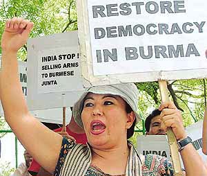 Burmese refugees and pro-democracy activists participate in an anti-military demonstration