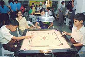 Nikhil aims to strike on the opening day of the Ninth St Stephens Carrom Ranking Tournament held at St Stephens School, Sector 45, Chandigarh, on Wednesday. 