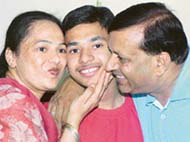 Deepankar Garg, who topped the ICSE exam in the tricity, with his parents in Mani Majra