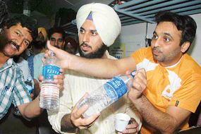 Comedian Bhagwant Mann protests against substandard catering on the New Delhi-Kalka Shatabdi at the Ambala Cantt railway station on Wednesday.