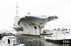 The former aircraft carrier Clemenceau arrives in the port of Brest, France, on Wednesday.