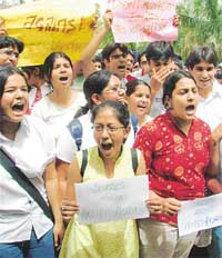 Students of Delhi Public School shout slogans against the proposed reservation policy in New Delhi on Friday