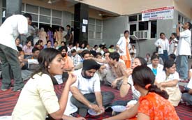 Students of Dayanand Medical College and Hospital hold a dharna outside the hospital in Ludhiana on Saturday