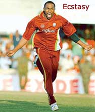 Dwayne Bravo of the West Indies celebrates after taking the match-clinching wicket of Yuvraj Singh
