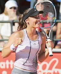 Martina Hingis of Switzerland celebrates after winning the Italian Open final against Russias Dinara Safina in Rome on Sunday. Hingis won 6-2, 7-5.