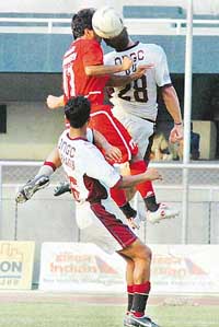JCT Phagwaras Parveen Kumar (left) and Eduardo Coelho of Mohun Bagan locked in an aerial duel in a NFL match in Ludhiana on Sunday.