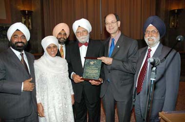 From left: Gurbax Singh Bhasin; Bibi Inderjit Kaur, wife of Late Yogi Bhajan; Dr Rajwant Singh; Dr Amarjit Singh Marwah; Congressman Brad Sherman; and Dr Darshan Singh Saluja