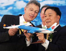 Lufthansa Airlines Chairman and Chief Executive Wolfgang Mayrhuber  and Air China Chairman Ji Jiaxiang
