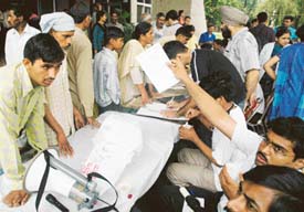 Resident doctors of the PGI, Chandigarh,  run a parallel OPD, where they examined over 700 patients  on Monday. Tribune photo: Vinay Malik