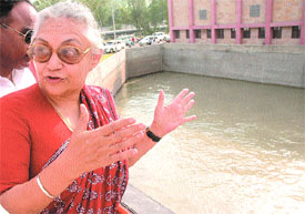 Delhi Chief Minister Sheila Dikshit after opening the inlet gates for water at the Sonia Vihar water treatment plant in the Capital on Monday