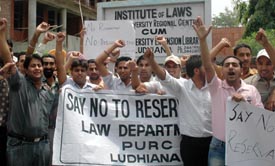 Students of the Department of Laws, Panjab University Regional Centre, take part in a demonstration against the proposed hike in quota for the OBCs in Ludhiana on Monday