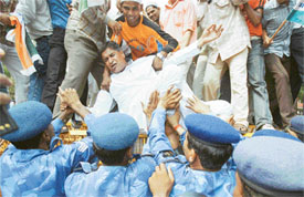 Pro-reservation activists scuffle with policemen during a protest in New Delhi on Monday
