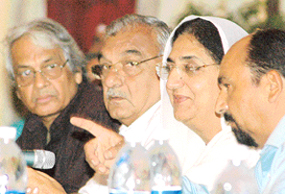 The Haryana Chief Minister, Mr Bhupinder Singh Hooda, and the Deputy Chief Minister of Punjab, Mrs Rajinder Kaur Bhattal, at the fourth state meeting of the Chandigarh-Punjab Union of Journalists in Chandigarh on Tuesday.
