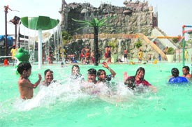 Visitors enjoy a dip in the water park in Wonderland, Jalandhar