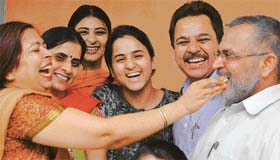 Jubilant family members of Raghu Mahajan, the all-India topper of the All-India Engineering Entrance Examination, celebrate at their residence in Chandigarh