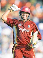Ramnaresh Sarwan of the West Indies celebrates after completing a century during the third one-dayer against India in Basseterre, St. Kitts