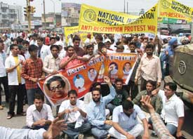 Medical students and members of several other organisations stage a dharna and block traffic at Samrala Chowk in Ludhiana on Thursday