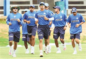 Rahul Dravid and team-mates jog during a training session at Queens Park in Port of Spain on Thursday