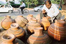 In sweltering summer, Bihari Lal of Madhya Pradesh keeps his pitchers full for those who stop to quench their thirst on the dividing road of Sector 45 and 46 in Chandigarh