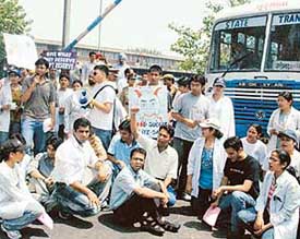 Medicos from GMCH-32 block all exit points at the ISBT as a mark of protest against the governments reservation
