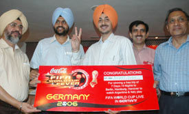 Sandeep Singh Grewal receives the ticket to Germany to watch the FIFA World Cup-2006, at a function held in Ludhiana