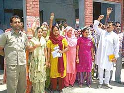 Residents of Bungal village protest in front of the SDMs office at Pathankot on Thursday. 