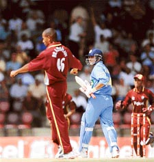 Ian Bradshaw of the West Indies celebrates after dismissing Indias Virender Sehwag during the fourth one-day international in Port of Spain on Friday