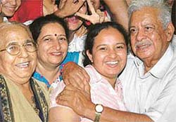 Ankita Gulati being hugged by her grandfather at their residence in Sector 4, Panchkula, on Saturday. 