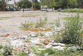 Garbage and construction waste which lies unattended in Sector 9, Chandigarh, for the past several months.