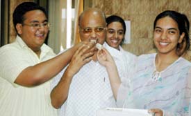 Yatish Jain with 96.4 per cent marks along with Mr SR Patial, Principal of DAV School, and Akriti, ranked second with 96 per cent marks, are all smiles at the good results