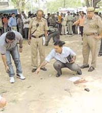 Police personnel at the crime scene near the Telegraph Square in the Capital