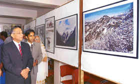 Breathtakingly beautiful: Governor Himachal V.S. Kokje watching the exhibition on snow Himachal, exhibited by Tribune photographer Anil Dayal at Shimla.