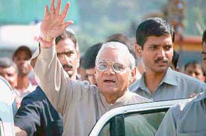 Former Prime Minister Atal Bihari Vajpayee waves to a crowd at Bhuntar during his visit to Manali on Wednesday.