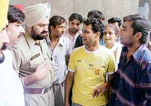 SP Kuldip Singh listening to the grievence of the relatives of Pawan Kumar in Ludhiana on Wednesday.