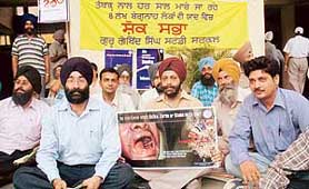 Members of the Guru Gobind Singh Study Circle hold a condolence meeting for the loss of human lives due to tobacco use in Ludhiana on Wednesday. 