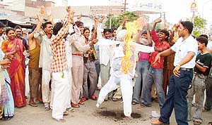 Residents burn an effigy of the Mayor in Ludhiana on Wednesday.