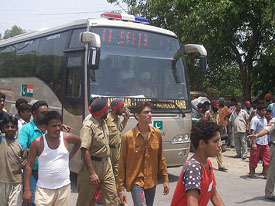 Residents stop the Amritsar-Lahore bus in protest against a faulty sewer in their locality in Amritsar on Wednesday.