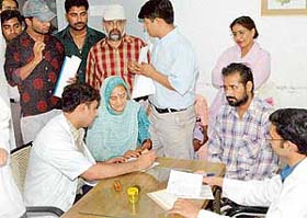 A senior resident attends to patients at the new OPD block of the PGI after doctors resumed work on Thursday in Chandigarh