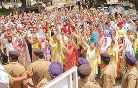 Employees of the Chandigarh Housing Board protest at their office in Sector 9, Chandigarh